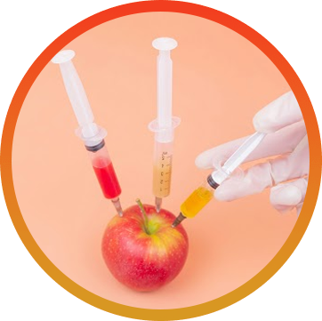 A hand holding three syringes and an apple.